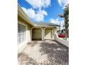 A covered brick carport provides sheltered parking and architectural detail at 12112 Shallot St, Orlando, FL 32837