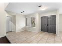Bright entryway with tile floors, double front door, and a closet at 140 Margate Mews, Longwood, FL 32779