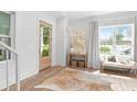 Bright foyer with hardwood floors, a stylish rug, and elegant decor at 1429 Indiana Ave, Winter Park, FL 32789