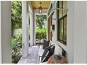 Charming covered front porch with comfortable seating and decorative accents at 1429 Indiana Ave, Winter Park, FL 32789