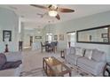Bright living room showcasing neutral paint, and ample seating for relaxation and entertainment at 149 Acadia Dr, Kissimmee, FL 34759