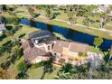 An aerial shot of the property highlighting the pool, water views, and lush landscaping at 169 Mallard Ln, Daytona Beach, FL 32119