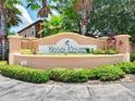 Elegant community entrance sign for Regal Palms at Highland's Reserve, surrounded by lush greenery at 202 Napoli Dr # 202, Davenport, FL 33897