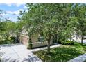 Aerial shot of home with two-car garage, well-maintained landscaping and large driveway at 2024 Beardsley Dr, Apopka, FL 32703
