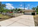 Spacious driveway leading to a two-car garage and a well-kept home exterior at 2074 S Parkton Dr, Deltona, FL 32725