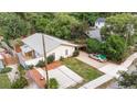 Charming single-story home with a well-maintained front yard, cozy carport, and paved basketball area at 2825 Mayer St, Orlando, FL 32806