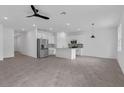 Open-concept kitchen features stainless steel appliances and a large island at 2908 Lingo Ln, Orlando, FL 32822