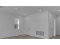 A clean and bright living room featuring neutral walls and recessed lighting at 305 Platform Ln, Debary, FL 32713