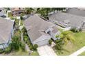 Aerial view of a single-story home with a brown roof and large screened-in lanai at 491 Freeman St, Longwood, FL 32750
