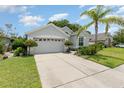 Inviting one-story home with a well-maintained lawn and two-car garage at 491 Freeman St, Longwood, FL 32750