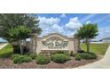 Attractive community sign at North Ridge Reserve, surrounded by lush landscaping and manicured shrubbery at 651 Taft Dr, Davenport, FL 33837