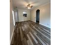 Spacious living room with ceiling fan and attractive wood-look flooring at 7147 Yacht Basin # 132, Orlando, FL 32835