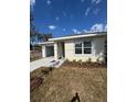 One-story home featuring a tidy front yard and a convenient attached garage at 1007 Colyer St, Orlando, FL 32805