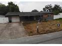 Exterior view of a single story home with front porch and driveway at 1206 Olen Dr, Daytona Beach, FL 32117