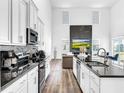 Open concept kitchen with sleek countertops and stainless steel appliances at 1210 Lone Palm Way, St Cloud, FL 34771