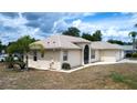 Charming single-story home featuring stucco siding, a two-car garage, and landscaped front yard at 1312 Catalina Blvd, Deltona, FL 32725