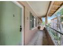 Exterior view of unit with green door, windows, and a patio area at 136 Blue Point Way # 320, Altamonte Springs, FL 32701