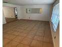 Bright living room featuring tile flooring, a window, and a neutral color scheme at 1985 Japonica Rd, Winter Park, FL 32792
