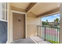 Balcony view of tennis court, showing palm trees and blue skies, a private outdoor space for relaxation and recreation at 2213 Grand Cayman Ct # 1138, Kissimmee, FL 34741