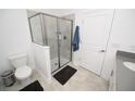 Modern bathroom featuring a glass-enclosed shower and stylish fixtures at 3027 Addison Blvd, St Cloud, FL 34771