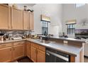 Well-equipped kitchen featuring ample countertop space, modern appliances, and a breakfast bar for casual dining at 9104 Stromboli Ct, Kissimmee, FL 34747