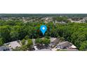Aerial view of a house with a blue location marker surrounded by trees and neighborhood at 10255 Cody Ln, Orlando, FL 32825