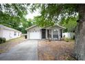 Charming single-story home with a well-maintained front yard and attached garage at 10255 Cody Ln, Orlando, FL 32825