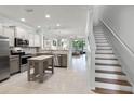 Bright, open kitchen featuring stainless steel appliances and a center island at 1109 Pavia Dr, Apopka, FL 32703