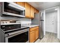 Updated kitchen features stainless steel appliances and granite countertops at 1163 Paseo Del Mar # B, Casselberry, FL 32707