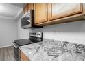 Updated kitchen features stainless steel appliances and granite countertops at 1163 Paseo Del Mar # B, Casselberry, FL 32707