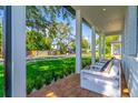 Inviting front porch with brick flooring and comfortable seating area at 1321 Weber St, Orlando, FL 32803