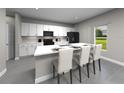Modern kitchen featuring white cabinets, a large island, and stainless steel appliances at 16544 Silver Brook Way, Winter Garden, FL 34787