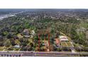 An aerial view of the outlined land, featuring lush, mature tree coverage and convenient access to roads at 2214 Rouse Rd, Orlando, FL 32817