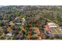 A beautiful parcel of land outlined in red with mature trees, awaiting its next chapter of development at 2214 Rouse Rd, Orlando, FL 32817