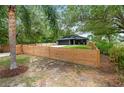 Lovely home with a fenced yard offering privacy and security in a lush, green setting at 2415 S Oak Ave, Sanford, FL 32771