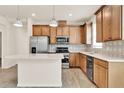 Bright kitchen featuring stainless steel appliances, stylish backsplash, and an island at 2458 Cliff Way, St Cloud, FL 34771