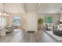 Bright foyer showcasing an open floor plan with elegant dining and living areas, enhancing the sense of space at 2755 Abbey Ave, Orlando, FL 32833