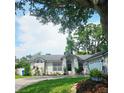 Attractive single-story home featuring a green lawn, lovely landscaping and plenty of curb appeal at 5005 Mill Stream Rd, Ocoee, FL 34761