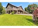 Spacious house with lush lawn and convenient lower-level access and exterior stairs at 6375 Topsy Trl, St Cloud, FL 34771