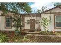 Inviting front porch with tiled floor and neutral siding, perfect for relaxing at 1405 Paula Dr, Apopka, FL 32703