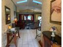 Inviting living room featuring tile floors, skylights, and comfortable seating at 1585 Stefan Cole Ln, Apopka, FL 32703