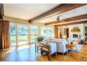 Bright living room featuring hardwood floors, a fireplace, and sliding doors to the backyard at 2001 Lily Ct, Sanford, FL 32771