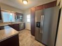 The updated kitchen features stainless steel appliances and modern fixtures at 2808 Drake Dr, Orlando, FL 32810