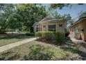 Charming single-story home featuring manicured landscaping and a welcoming walkway at 289 N Wilderness Pt, Casselberry, FL 32707