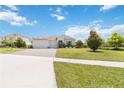 Attractive single-story home with a well-maintained lawn and paved driveway at 4119 Sunset Preserve Blvd, Orlando, FL 32820