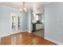 Dining room with glass French doors and a view into the kitchen at 439 Sunrise Ct, Orlando, FL 32803