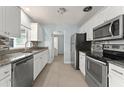 Updated kitchen with stainless steel appliances and granite countertops at 439 Sunrise Ct, Orlando, FL 32803