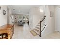 Open entryway with a view into the living room and staircase at 488 Kistler Cir, Clermont, FL 34715