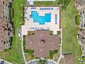 Aerial view of the community pool and recreation center offers residents a relaxing getaway at 621 Terrace Ridge Cir # 621, Davenport, FL 33896