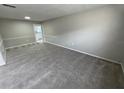 Spacious carpeted living room offering easy access to the kitchen at 6624 Kristin Ct, Orlando, FL 32818